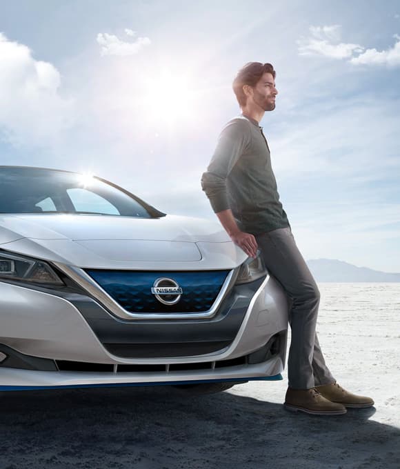 Man Beside Nissan LEAF